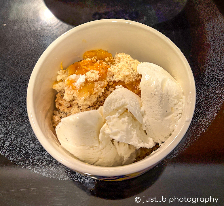 Home made apricot cobbler with vanilla ice cream.