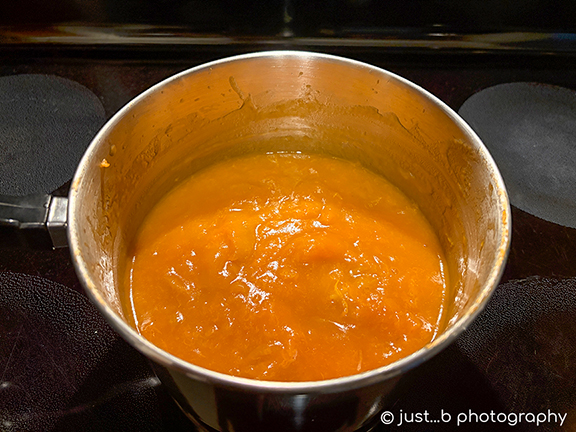 Saucepan of freshly made apricot jam.