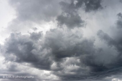 Dark grey and black clouds ahead of a summer thunderstorm over Santa Fe, NM.